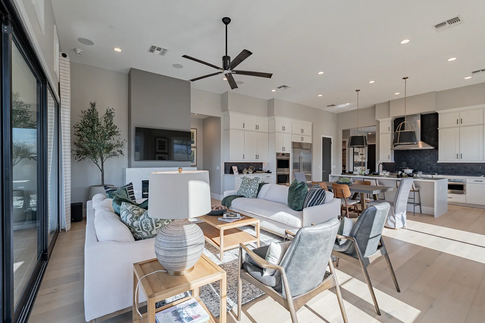 The open great room and kitchen of a Capital West home