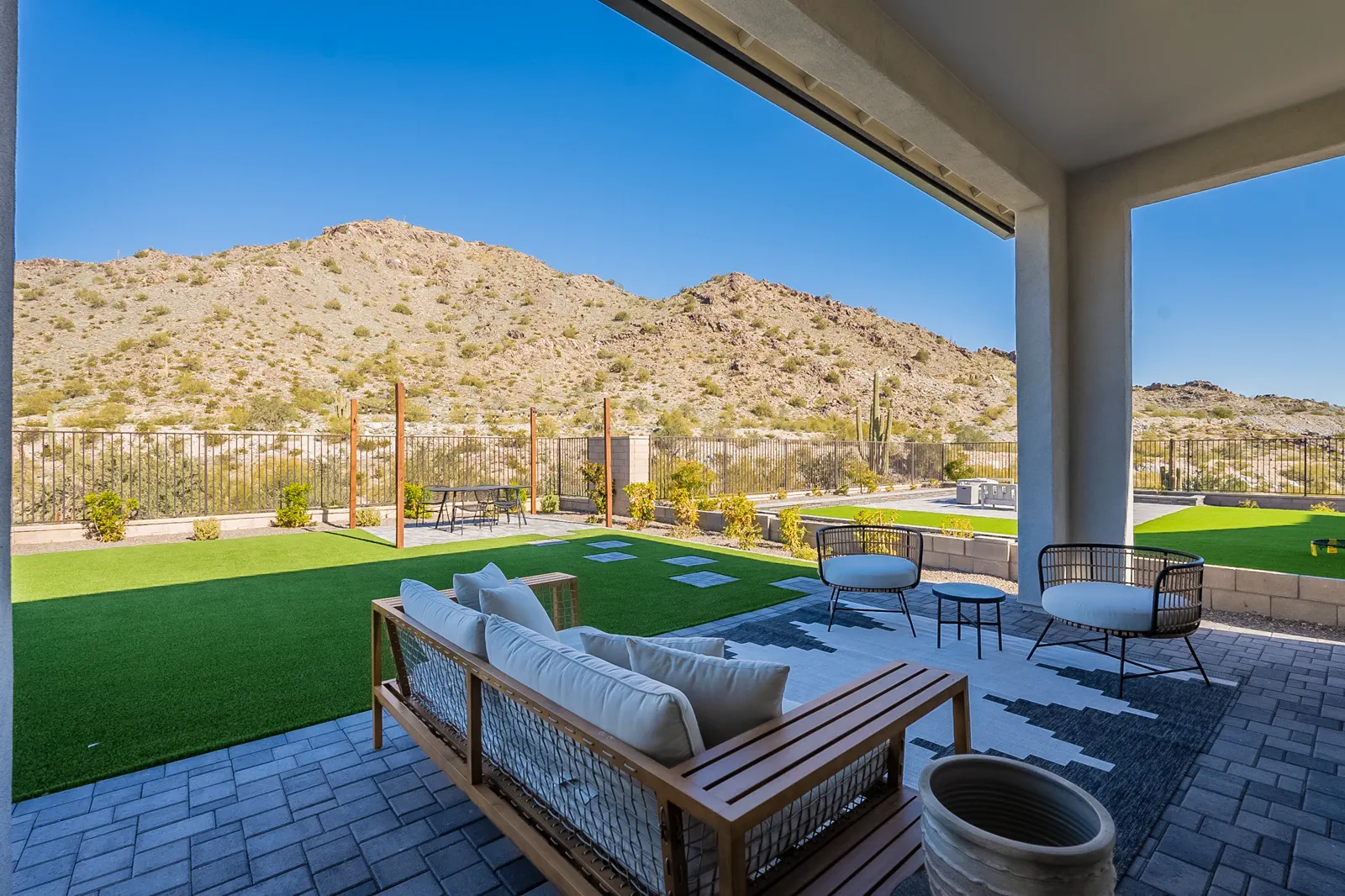 A covered patio with mountain views at a Capital West home